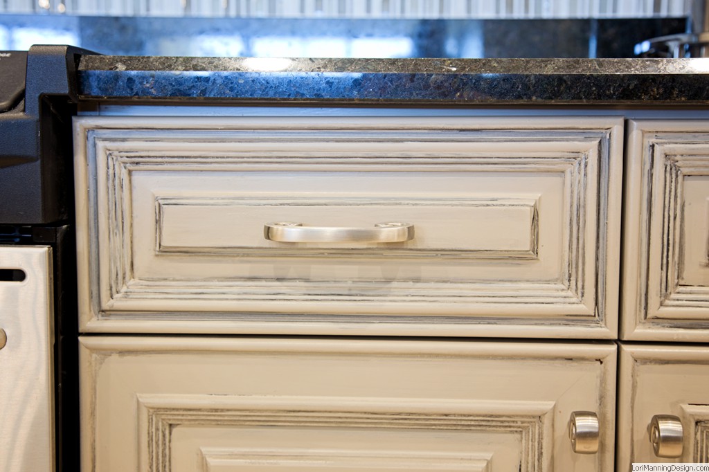 Cabinets faux finished in a taupe color with a glazing