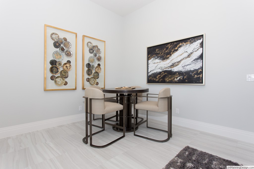 Family Room -  Metal counter height game table, large artwork, floating artwork, gold and silver artwork