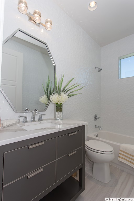 Guest Bathroom -  tile walls, gray vanity