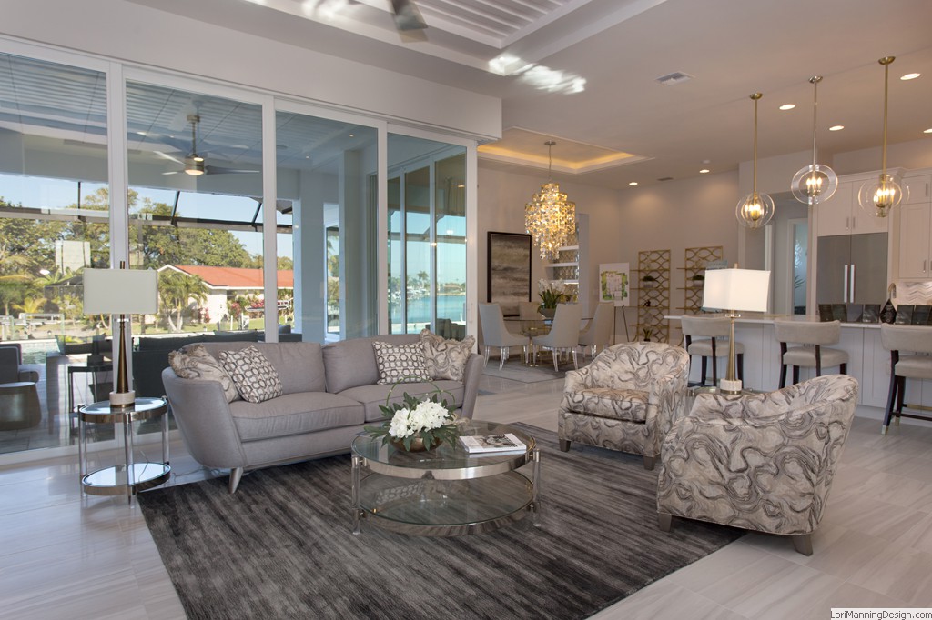 Living Room features mixed metal and tones of gray, acrylic, silver and gold